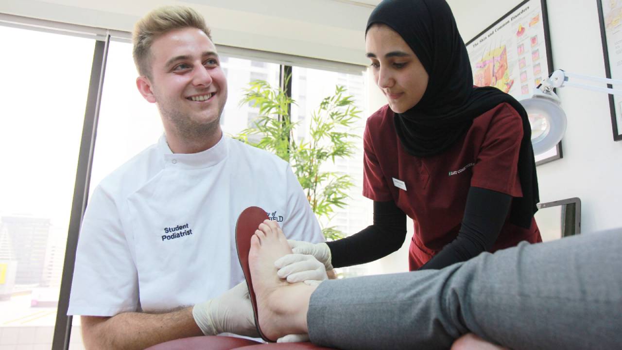Afnan assisting Lewis | East Coast Podiatry